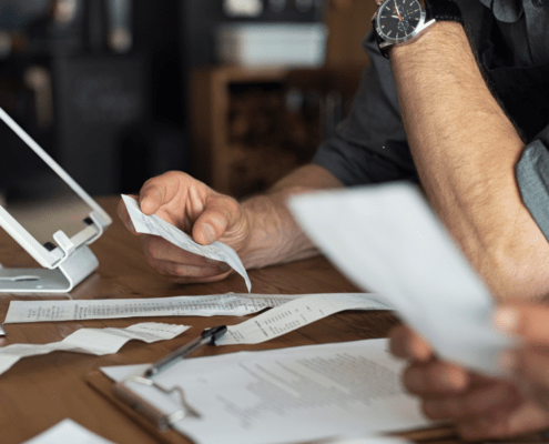 Man reviewing receipts