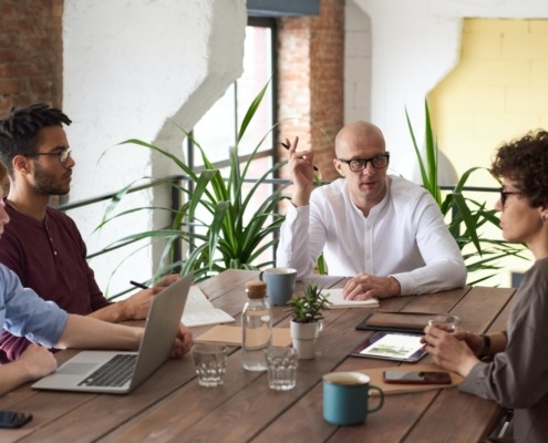 Four people having a meeting