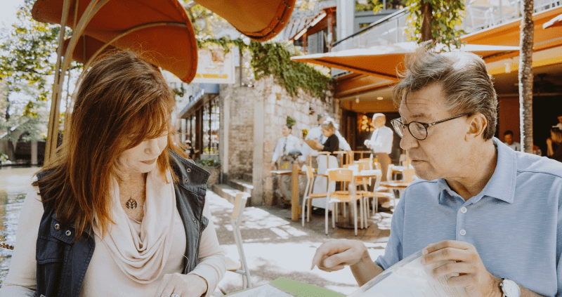 Man and women meeting in outdoor cafe
