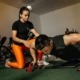 Man doing pushups with female trainer