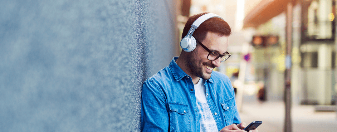 Young man listening with headphones on