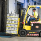 Young man driving forklift