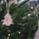 Wooden Christmas tree decorations hanging on tree