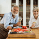 Older couple with glasses of wine in the kitchen