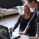 Two business women looking at laptop
